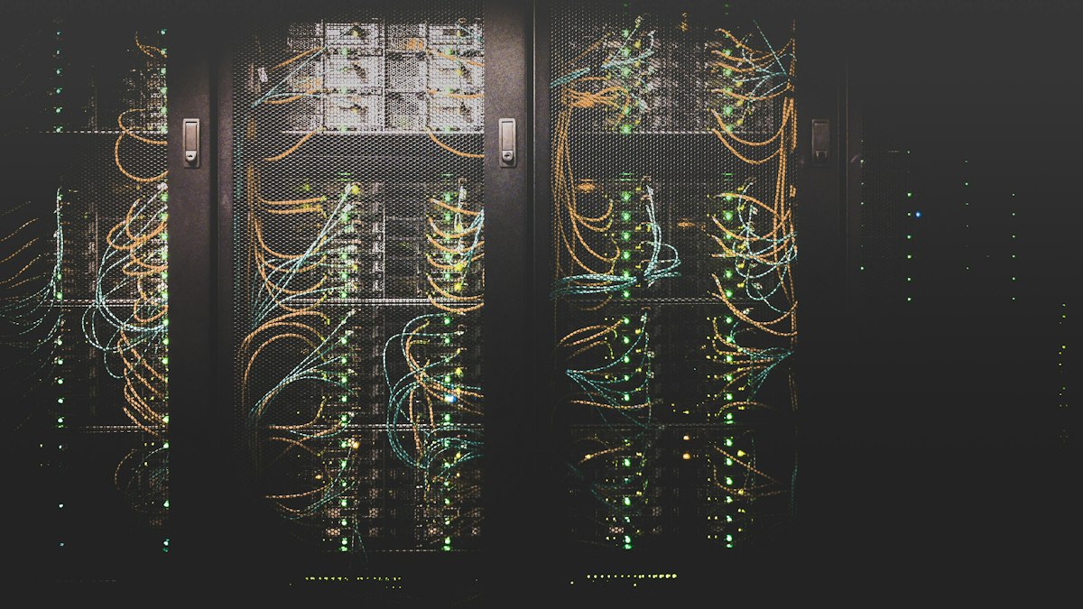 Bundles of network cables plugged into a server rack | AI agents 2026