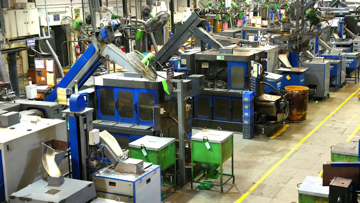 Machines and work cells along a factory floor marked with yellow lanes | Make in India