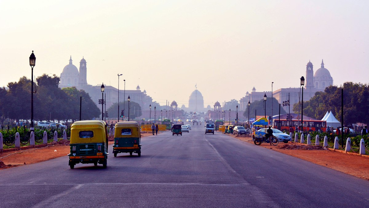 Auto rickshaws on a wide avenue leading to Rashtrapati Bhavan in New Delhi | Diwali 2026