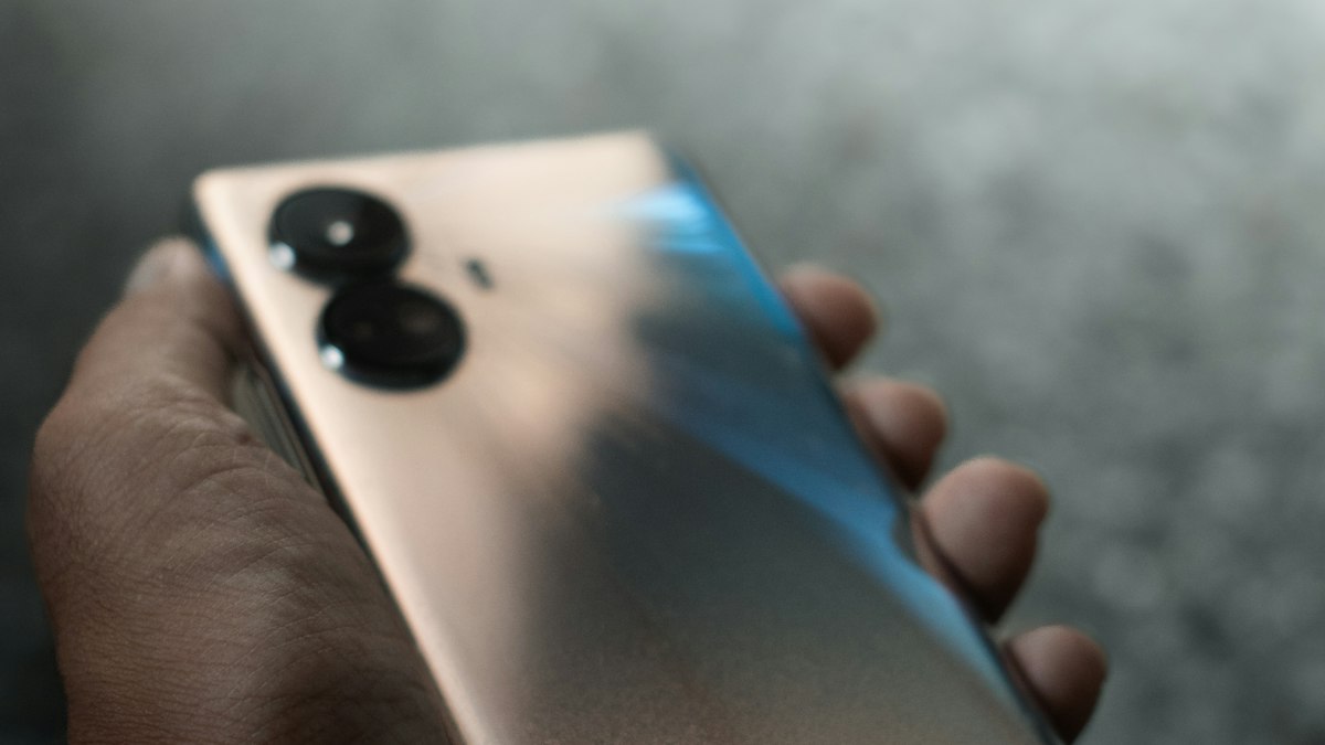 A hand holding a smartphone, the device most Indian payments now start on | Diwali 2026