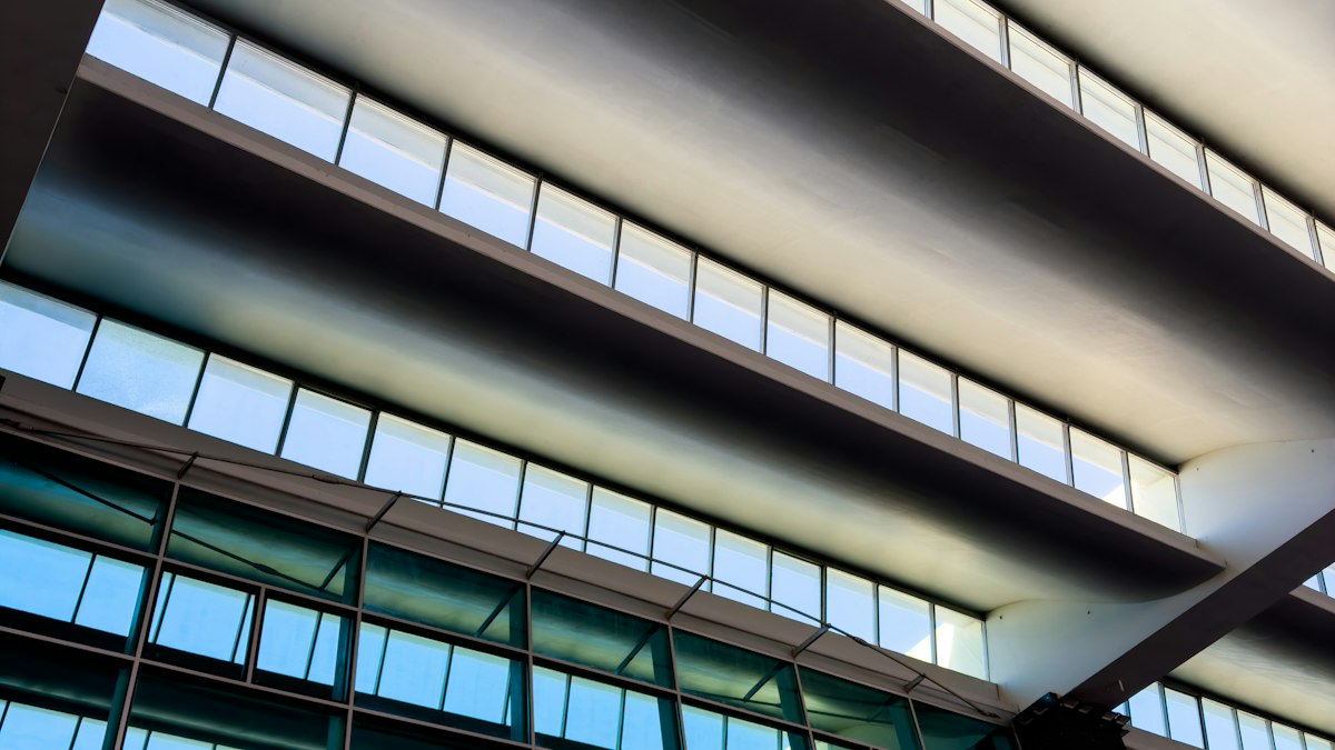 Glass and steel facade of a modern office building in Bengaluru | AI agents 2026