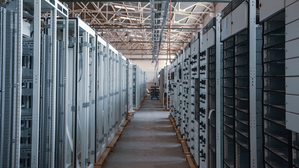 Rows of server racks along an aisle in a data centre