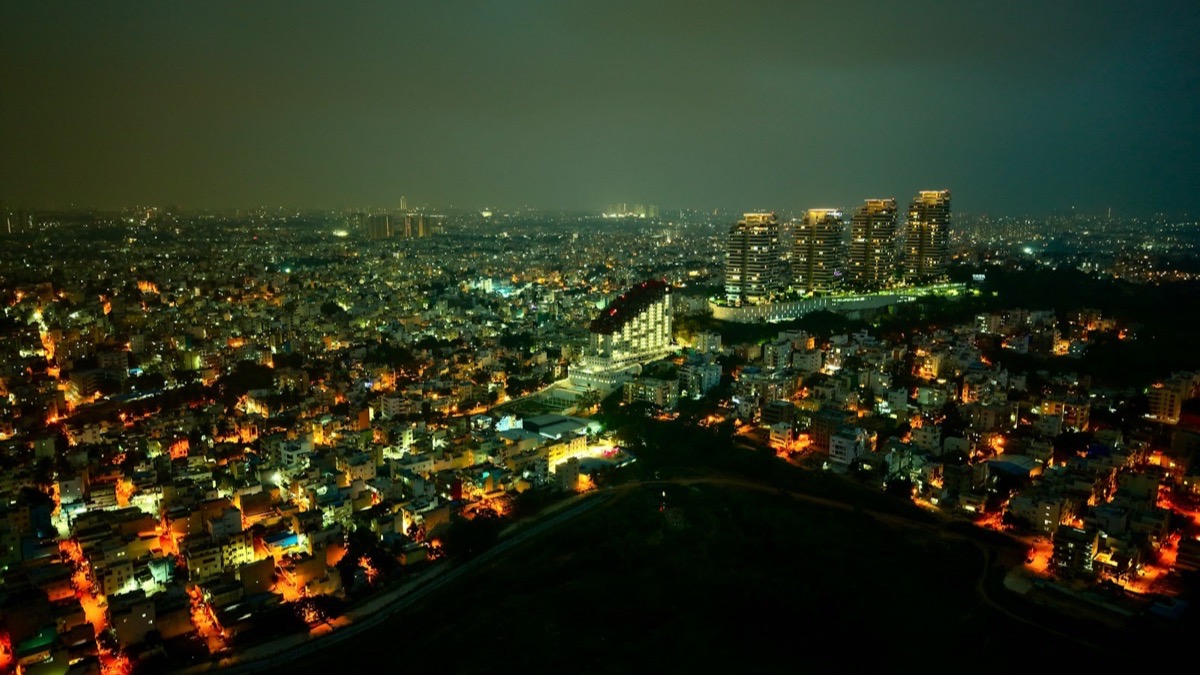 A city lit up at night, seen from above