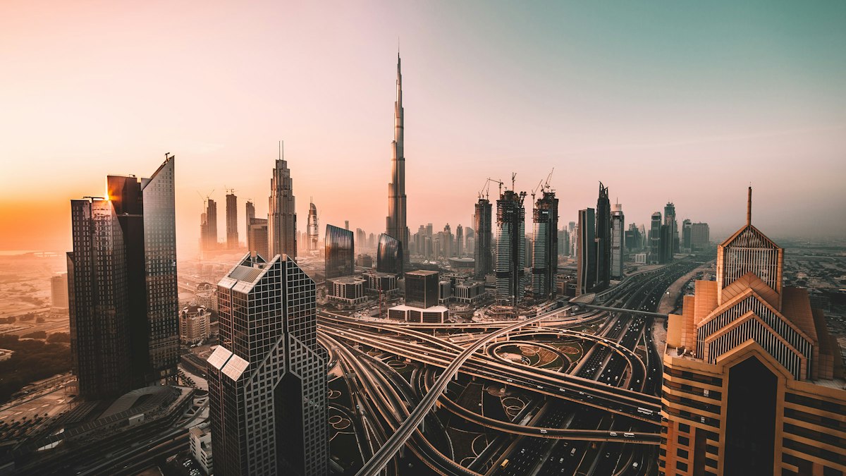 The Burj Khalifa and Dubai skyscrapers above a highway interchange | Al Nassr